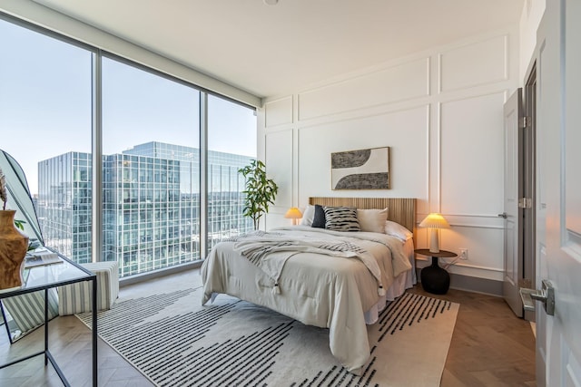 1616 W End Ave Unit 2602, Nashville, TN 37203 - bedroom featuring floor to ceiling windows, a decorative wall, and access to exterior