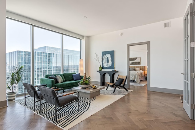 1616 W End Ave Unit 2602, Nashville, TN 37203 - living room with visible vents, a wall of windows, and baseboards
