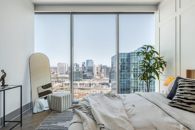 1616 W End Ave Unit 2602, Nashville, TN 37203 - bedroom featuring a city view and wood finished floors