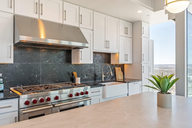1616 W End Ave Unit 2602, Nashville, TN 37203 - kitchen with range hood, range with two ovens, white dishwasher, a sink, and tasteful backsplash