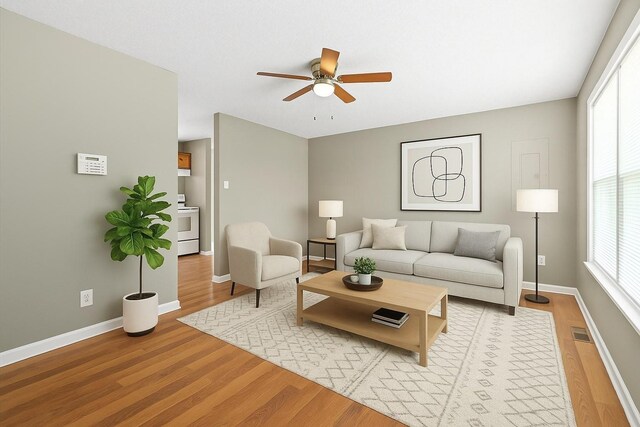 122 Gleaves Ln, Oak Grove, KY 42262 - living room featuring light wood-type flooring, baseboards, a ceiling fan, and visible vents