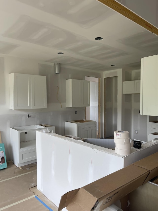 1513 Garners Creek Rd, Dickson, TN 37055 - kitchen featuring white cabinetry and concrete flooring