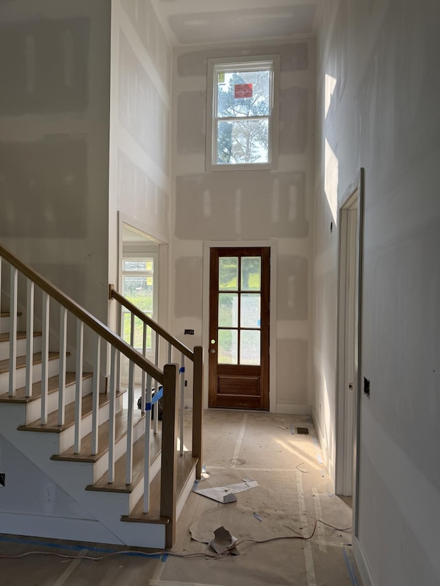 1513 Garners Creek Rd, Dickson, TN 37055 - foyer entrance featuring a high ceiling, plenty of natural light, and stairs