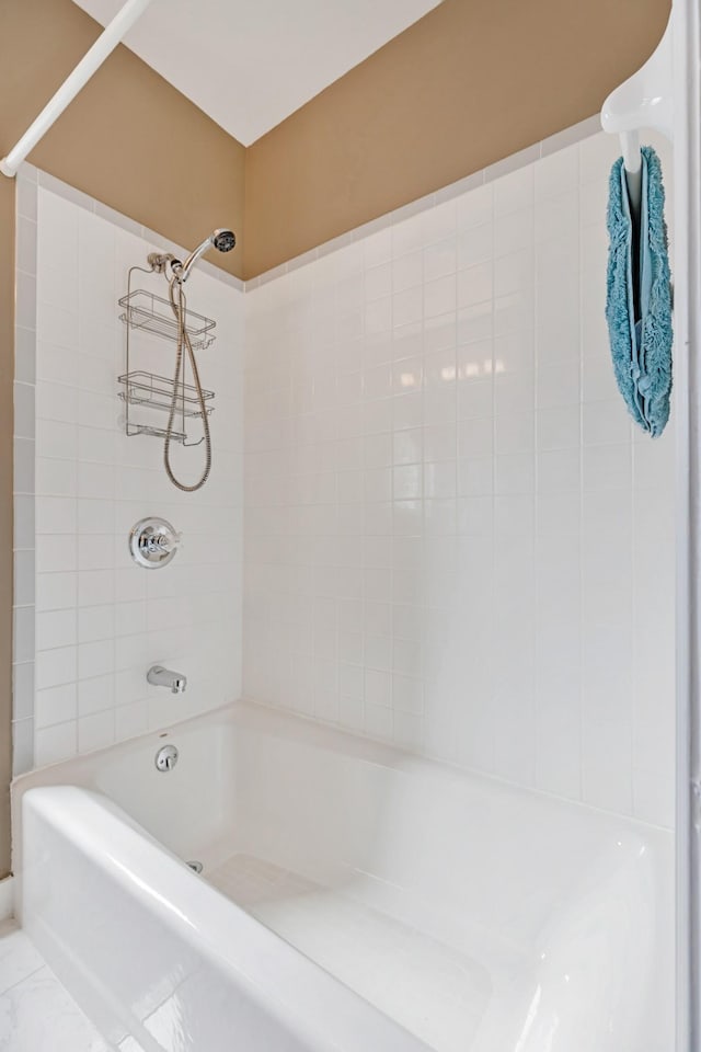 bathroom with shower / tub combination