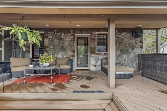 wooden deck with an outdoor living space