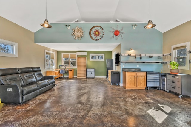 living room with high vaulted ceiling, concrete flooring, and baseboards