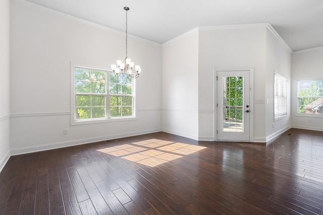 interior space featuring a notable chandelier, visible vents, baseboards, ornamental molding, and hardwood / wood-style flooring