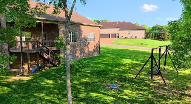 view of yard featuring stairway and a wooden deck