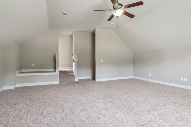 bonus room featuring vaulted ceiling, a ceiling fan, visible vents, and carpet floors