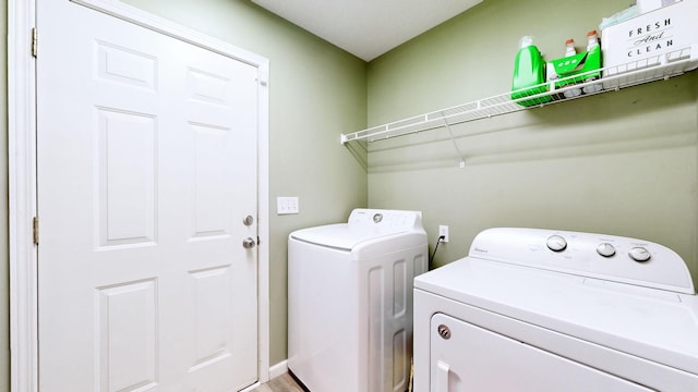 laundry area featuring laundry area and washing machine and clothes dryer