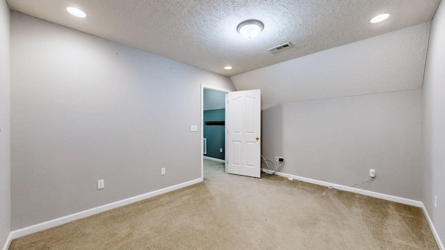 empty room featuring visible vents, baseboards, and carpet floors