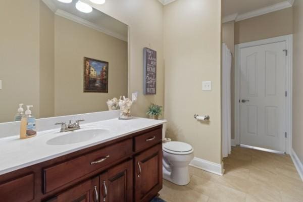 full bath with crown molding, vanity, baseboards, toilet, and tile patterned flooring