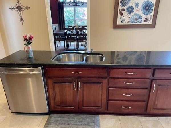 bar with an inviting chandelier, dishwasher, a sink, and light tile patterned floors