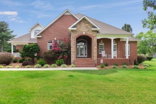 view of front of house with a front lawn and a porch