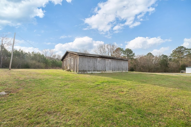 view of yard featuring an outbuilding and an outdoor structure