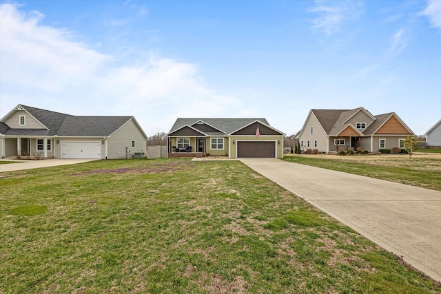 view of front of home with a front lawn, an attached garage, and driveway