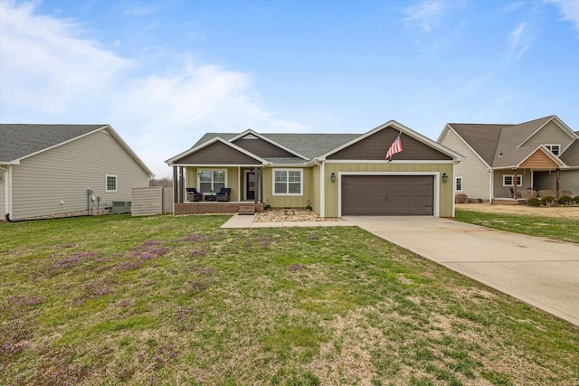 view of front facade with driveway, board and batten siding, covered porch, a front yard, and an attached garage