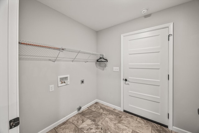 clothes washing area featuring laundry area, hookup for a washing machine, baseboards, and hookup for an electric dryer