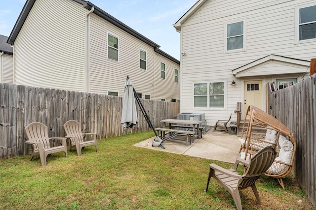 4009B Indiana Ave, Nashville, TN 37209 - rear view of property featuring a fenced backyard, a lawn, cooling unit, and a patio
