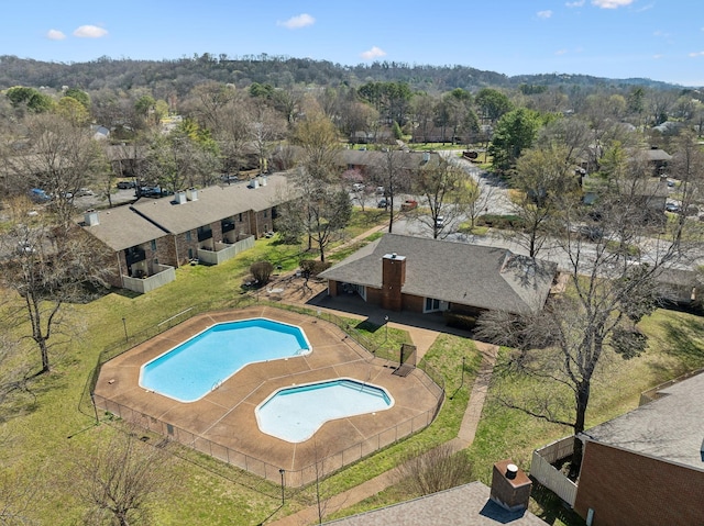 view of swimming pool featuring an enclosed area and fence