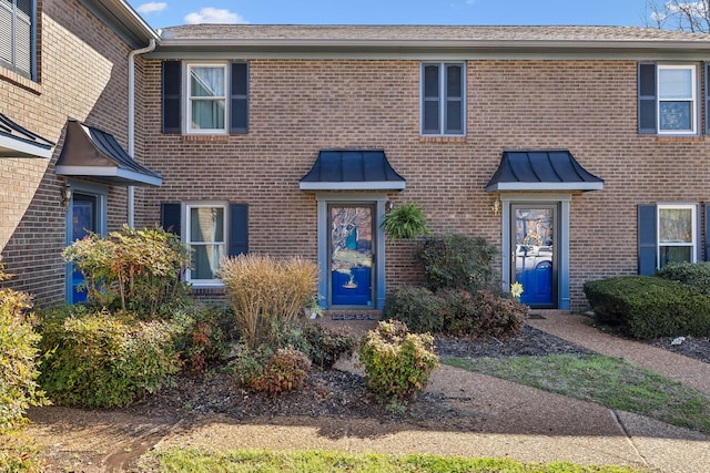 view of front of home with brick siding