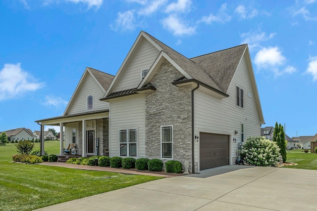 214 River Watch Way, Winchester, TN 37398 - view of front of property with stone siding, a porch, concrete driveway, and a front yard