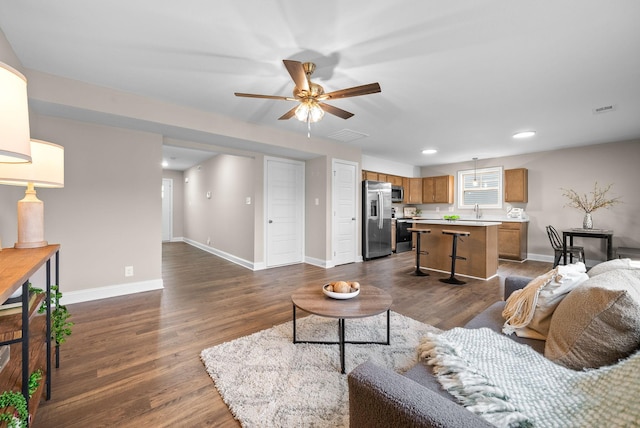 150 Cardinal Crk, Clarksville, TN 37040 - living area with a ceiling fan, dark wood-type flooring, baseboards, and recessed lighting