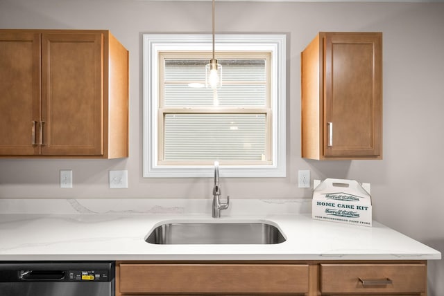 150 Cardinal Crk, Clarksville, TN 37040 - kitchen with dishwasher, a sink, brown cabinets, and decorative light fixtures