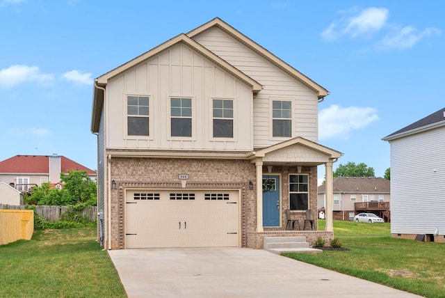 150 Cardinal Crk, Clarksville, TN 37040 - view of front of property featuring concrete driveway, an attached garage, board and batten siding, and brick siding