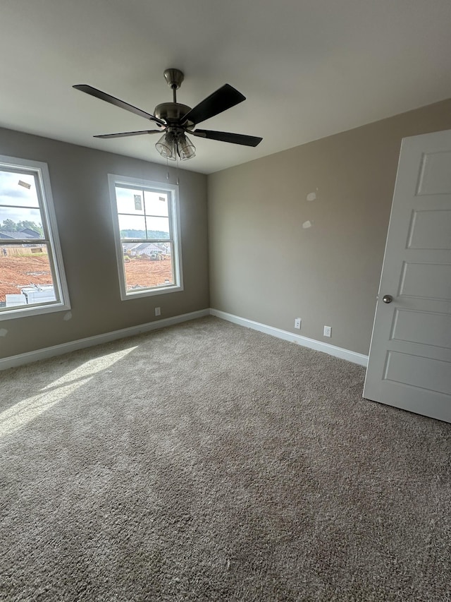 150 Cardinal Crk, Clarksville, TN 37040 - carpeted empty room with baseboards and a ceiling fan