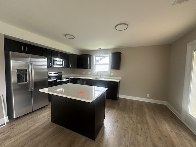 150 Cardinal Crk, Clarksville, TN 37040 - kitchen featuring appliances with stainless steel finishes, a sink, dark cabinets, and light countertops