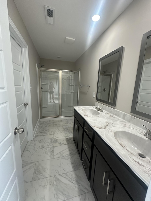 150 Cardinal Crk, Clarksville, TN 37040 - bathroom with a shower stall, marble finish flooring, and double vanity