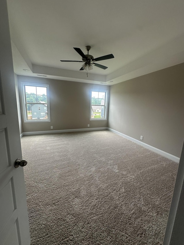 150 Cardinal Crk, Clarksville, TN 37040 - carpeted spare room featuring a tray ceiling, ceiling fan, and baseboards