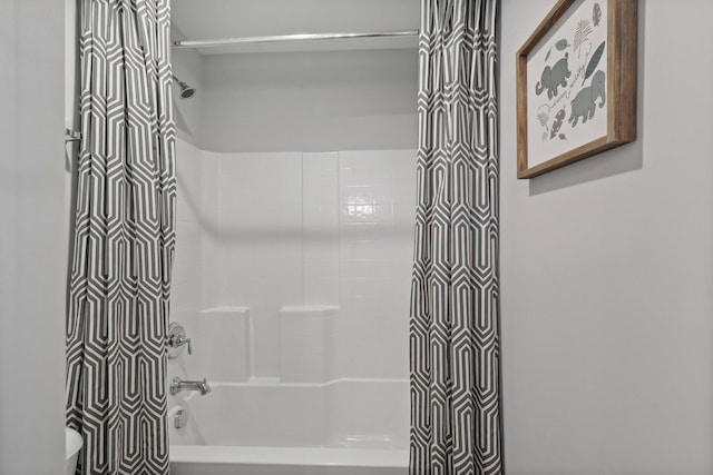 full bath featuring toilet and shower / bath combination with curtain