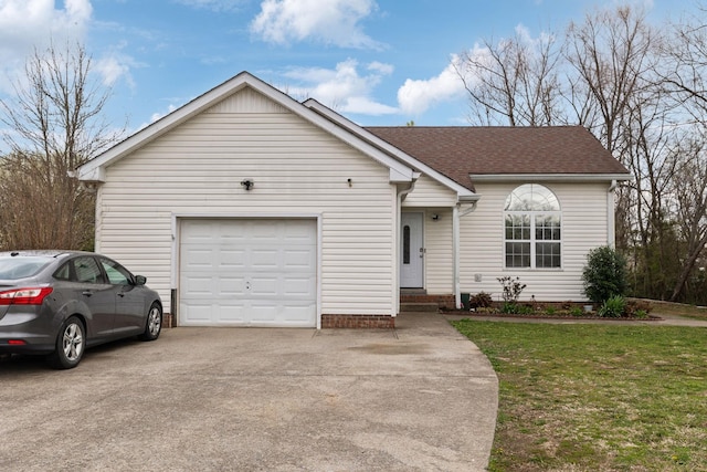 ranch-style home with a garage, roof with shingles, concrete driveway, and a front yard
