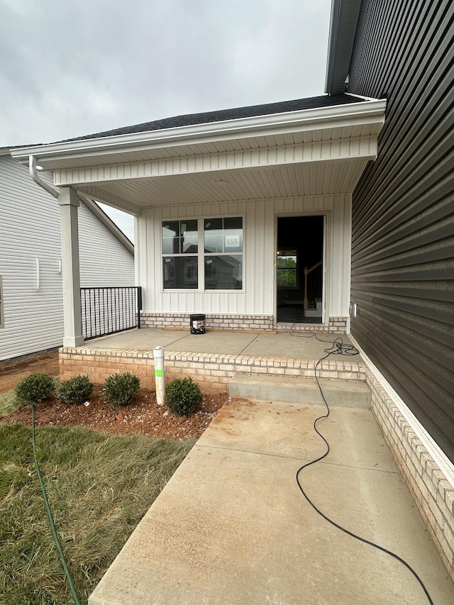 155 Cardinal Crk, Clarksville, TN 37040 - view of exterior entry with a porch and board and batten siding