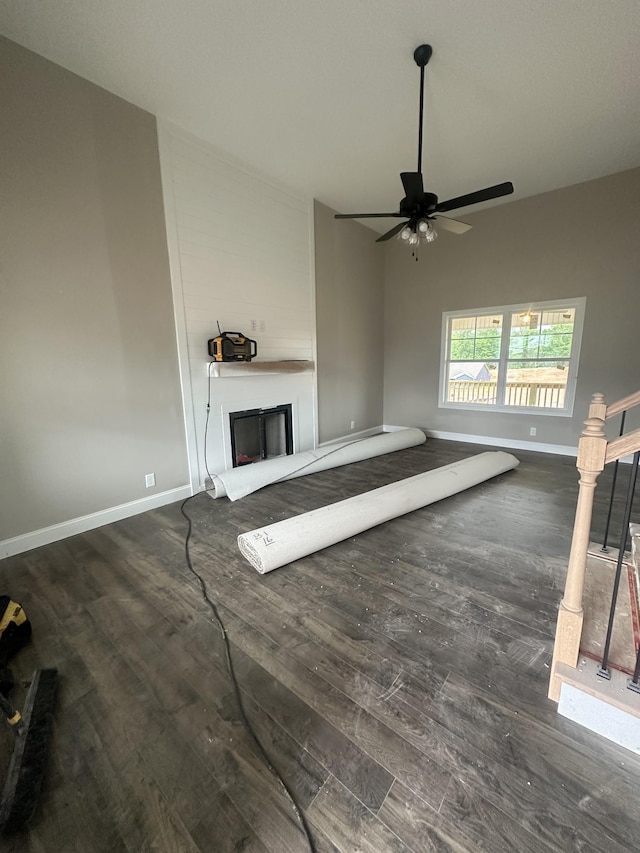 155 Cardinal Crk, Clarksville, TN 37040 - unfurnished living room featuring a fireplace, wood finished floors, baseboards, and ceiling fan