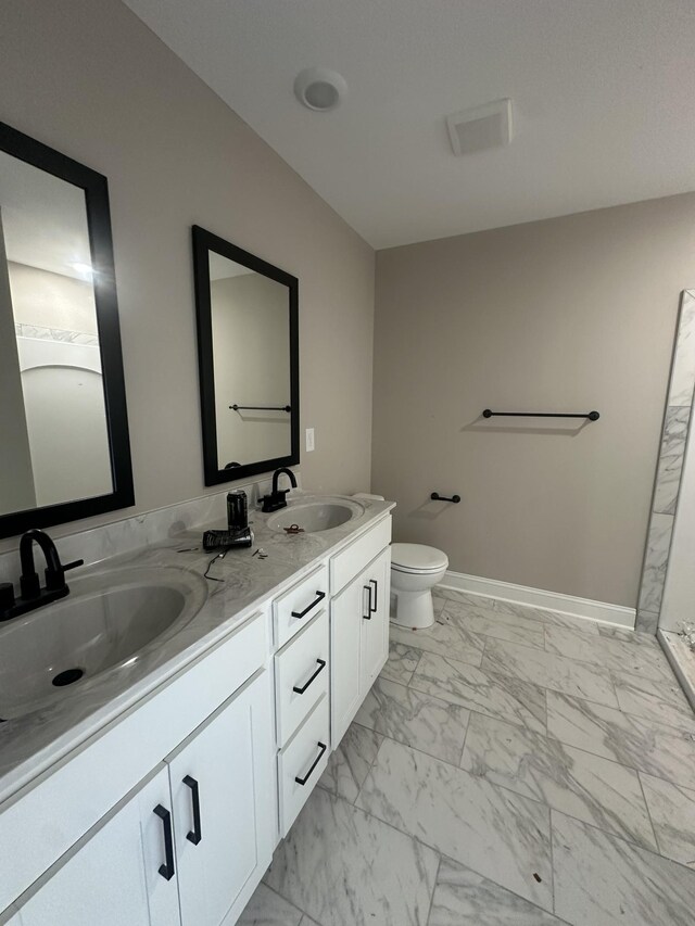 155 Cardinal Crk, Clarksville, TN 37040 - full bath with marble finish floors, double vanity, toilet, and baseboards