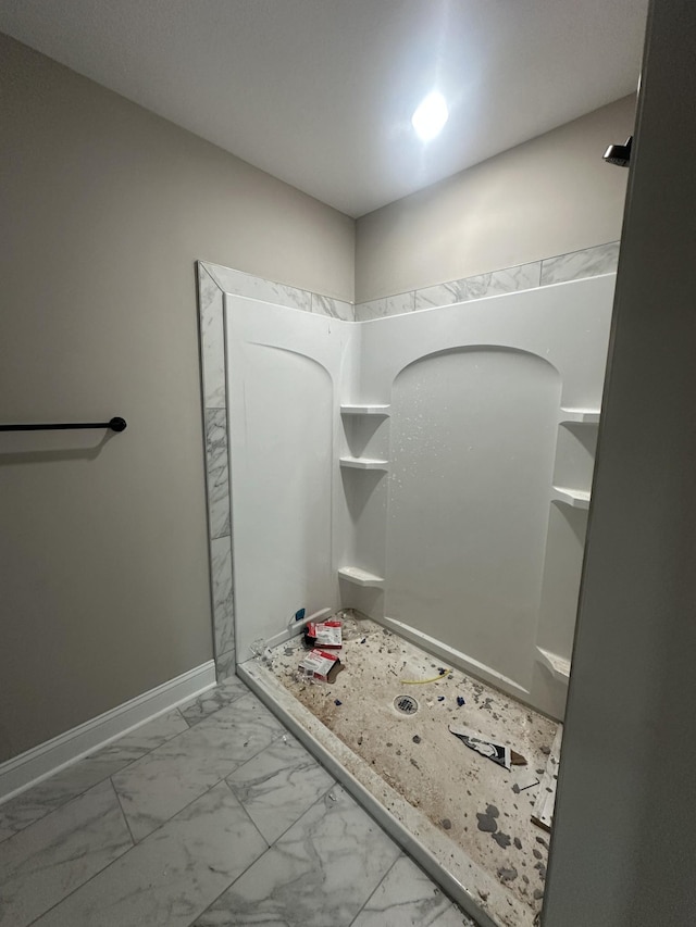 155 Cardinal Crk, Clarksville, TN 37040 - full bath featuring marble look tile flooring, baseboards, and a shower