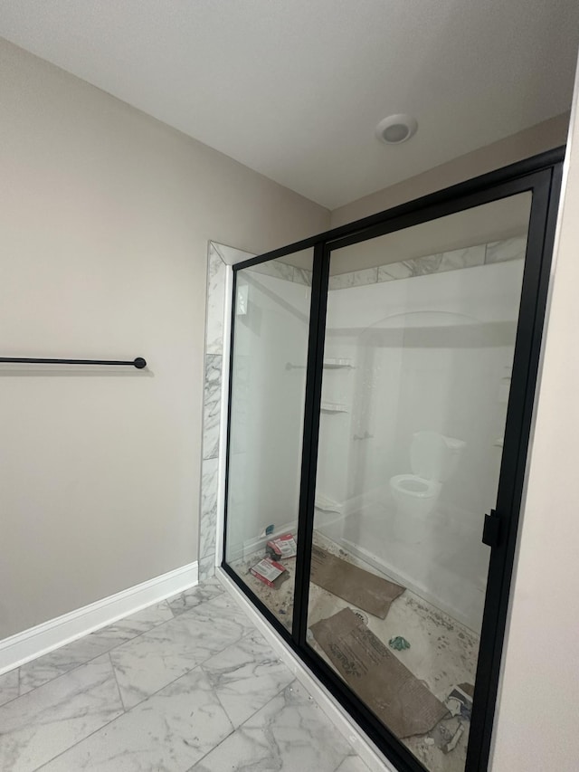 155 Cardinal Crk, Clarksville, TN 37040 - full bathroom featuring marble look tile flooring, a shower stall, and baseboards