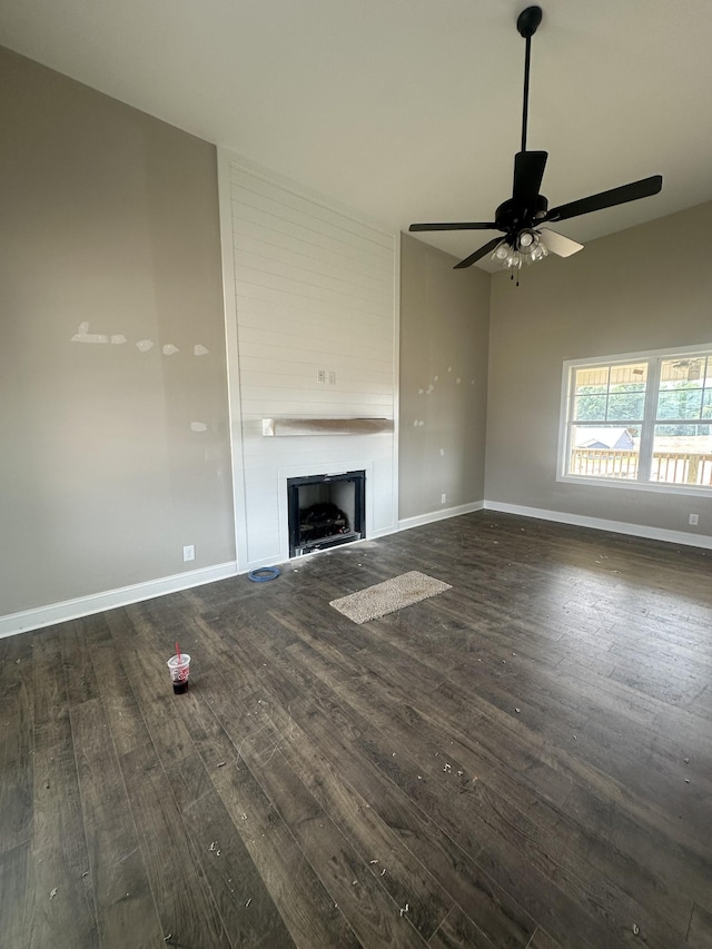 155 Cardinal Crk, Clarksville, TN 37040 - unfurnished living room featuring wood finished floors, a ceiling fan, a fireplace, and baseboards