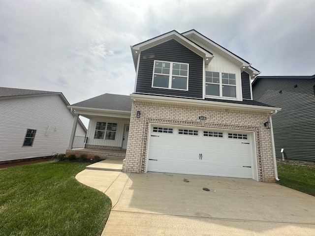 155 Cardinal Crk, Clarksville, TN 37040 - view of front of property with brick siding, an attached garage, driveway, and covered porch