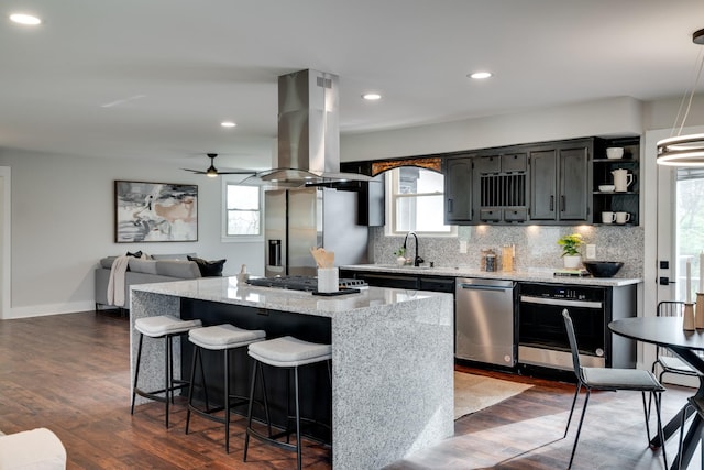 427A Kinhawk Ct, Nashville, TN 37211 - kitchen featuring a kitchen island, decorative backsplash, island exhaust hood, and stainless steel appliances