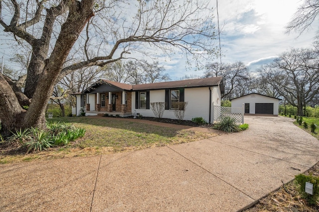 427A Kinhawk Ct, Nashville, TN 37211 - view of front facade featuring an outbuilding, driveway, a front yard, a garage, and brick siding