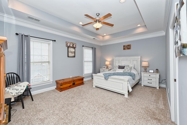 bedroom with baseboards, recessed lighting, visible vents, a tray ceiling, and carpet