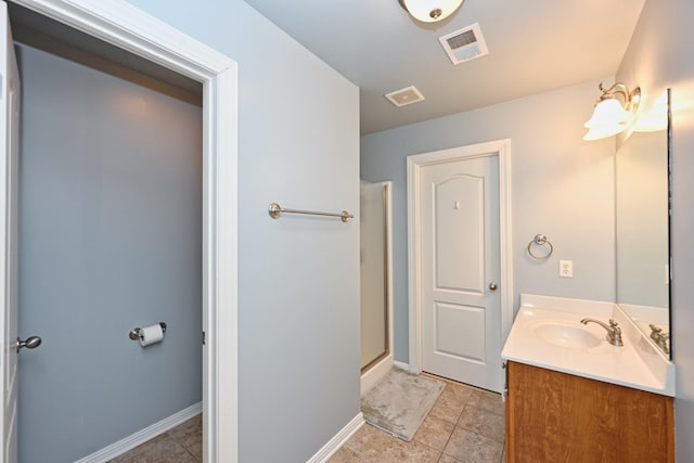 full bath featuring visible vents, tile patterned floors, vanity, and a shower with shower door