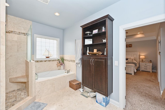 ensuite bathroom featuring recessed lighting, tile patterned flooring, connected bathroom, a walk in shower, and a bath