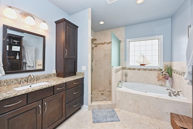 bathroom with a garden tub, a shower stall, vanity, tile patterned flooring, and visible vents