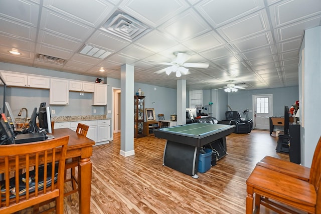 playroom with light wood-type flooring, ceiling fan, baseboards, and recessed lighting