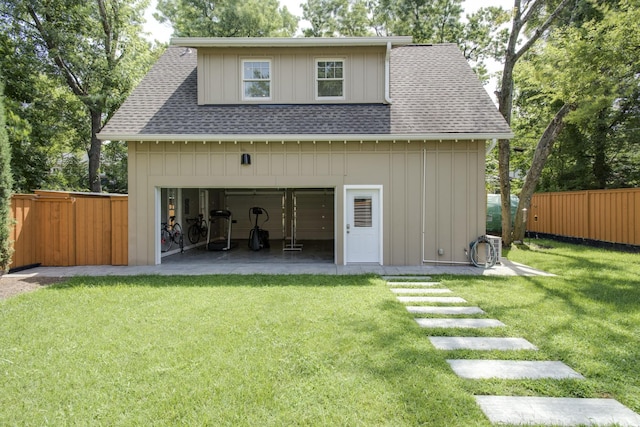 1926 20th Ave S, Nashville, TN 37212 - back of property with fence, board and batten siding, a shingled roof, a garage, and a yard